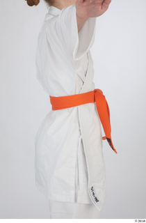 Selin dressed jiu-jitsu kimono orange belt sports upper body 0007.jpg